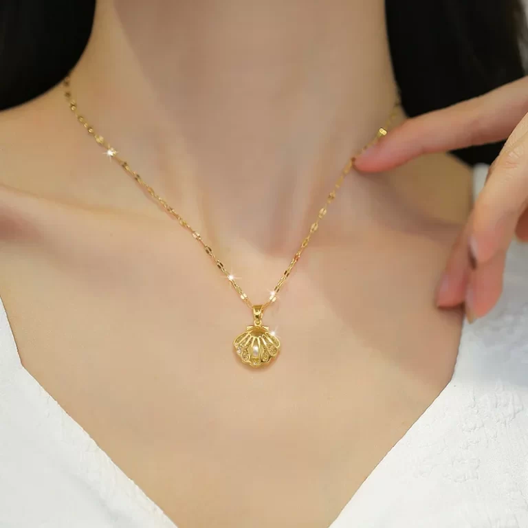 Collier perle avec pendentif coquillage or