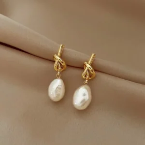 Boucles d'oreilles perles avec noeud doré