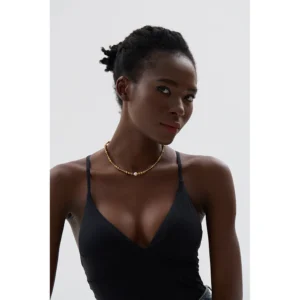 Collier de perles dorées avec perle blanche unique